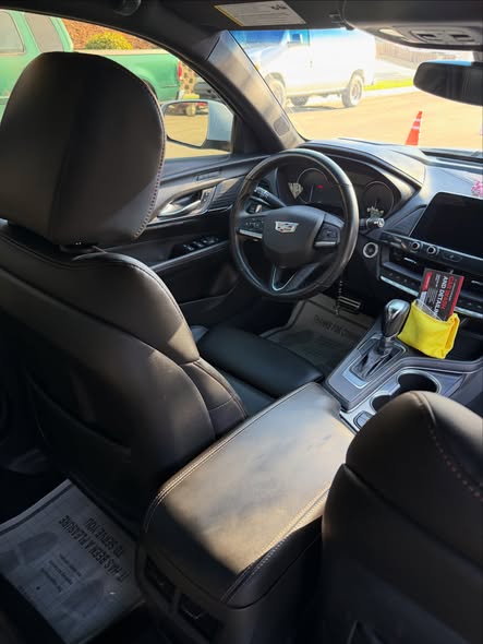 Clean black leather seats after an interior detail